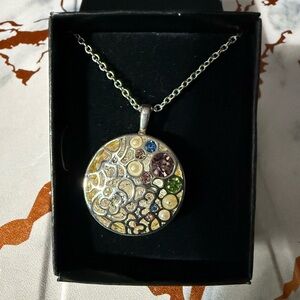 Necklace with colorful circular pendant